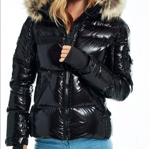 Blake style Sam down coat with fur on the hood. Cost is not as shiny in person